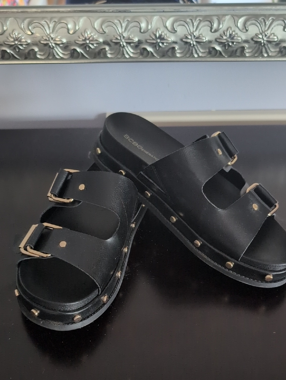BCBG Black Slide Sandals with Gold Studs and Buckles